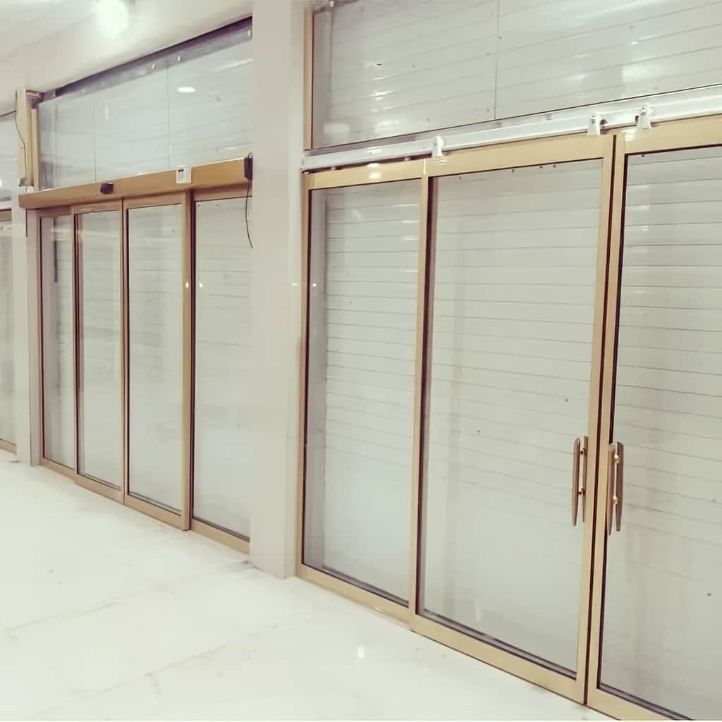 فروش درب اتوماتیک شیشه ای ساختمان اداری قاب نقرهای فروش درب اتوماتیک شیشه ای ساختمان اداری قاب نقرهای